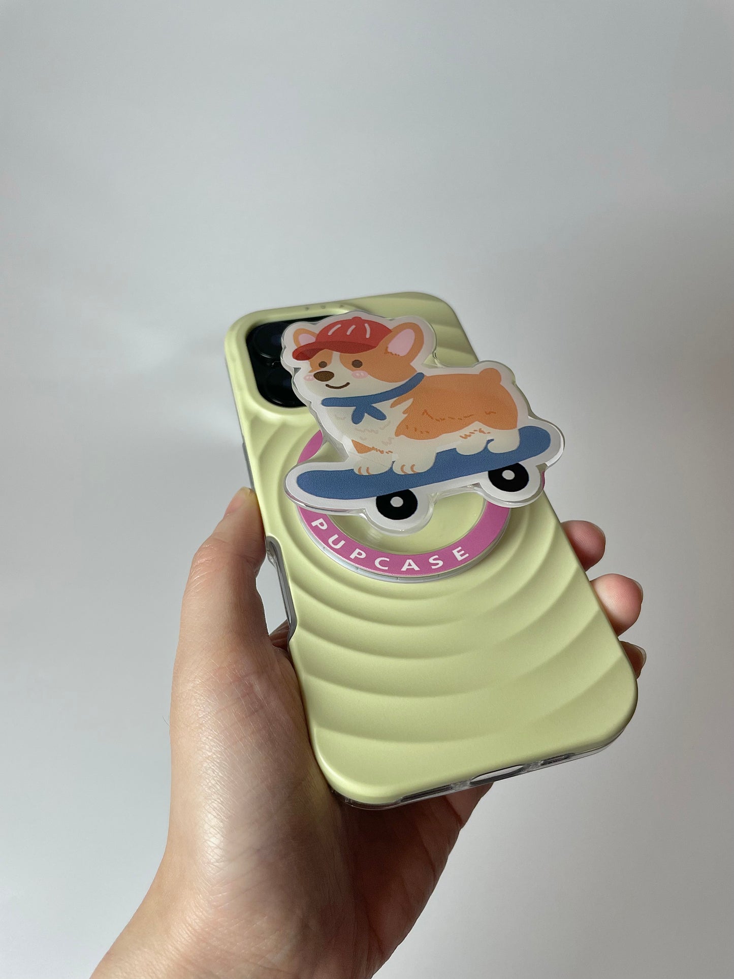 On a skateboard – Corgi Adventures Magnetic Phone Grip and Stand